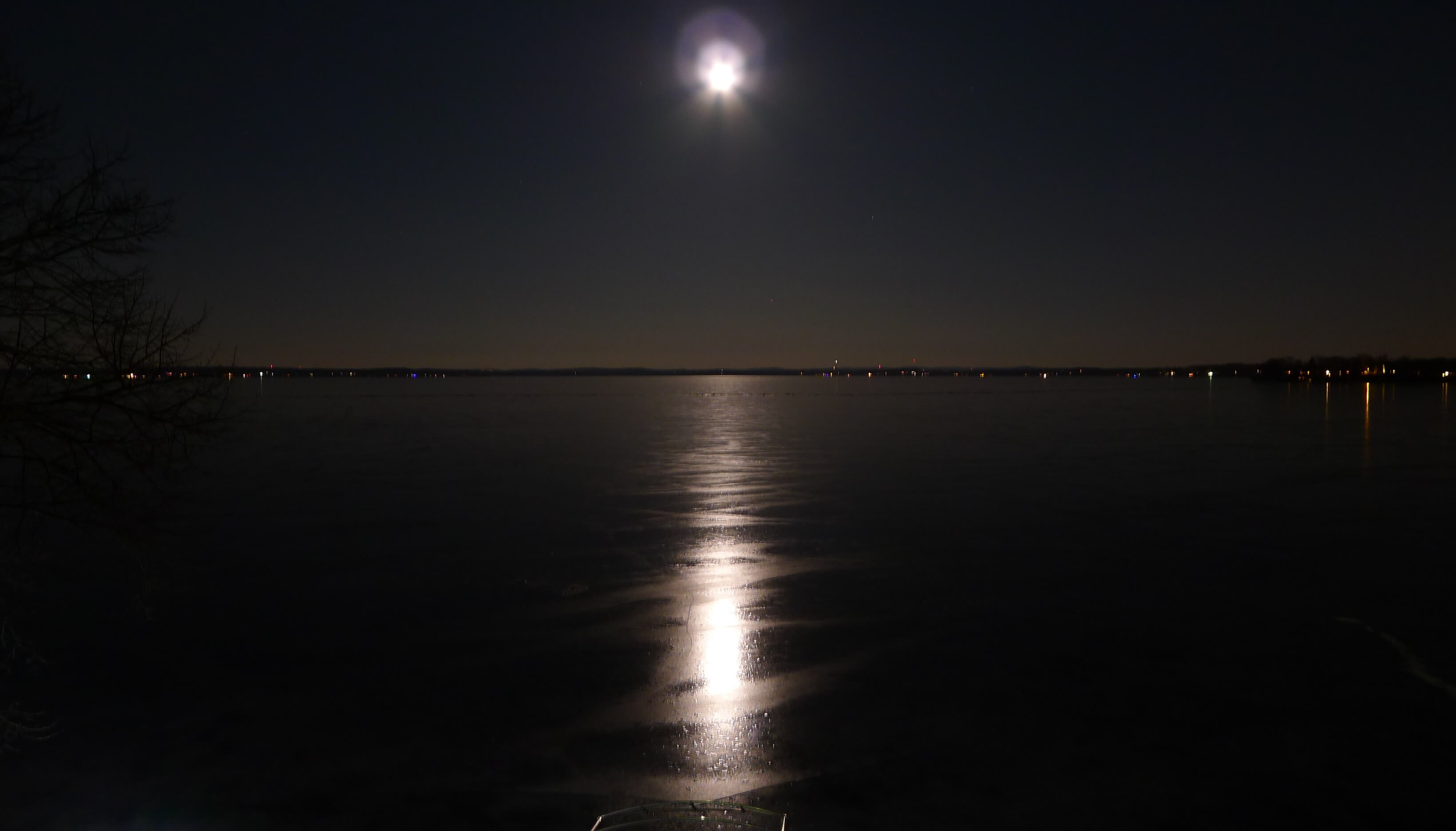 The moon splitting frozen Lake Kesonga